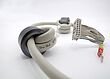 Spliced flat round cable with ferrite cores, IDC-connector and ring terminal